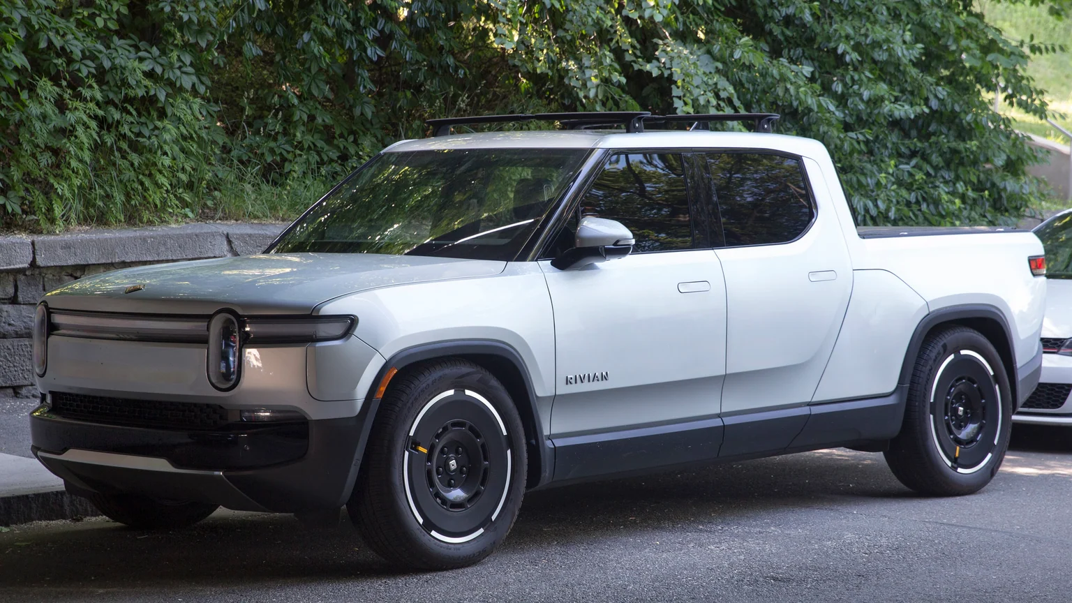 2025 Rivian R1T Adventure in LA Silver with the Road Trip Package, front left.jpg