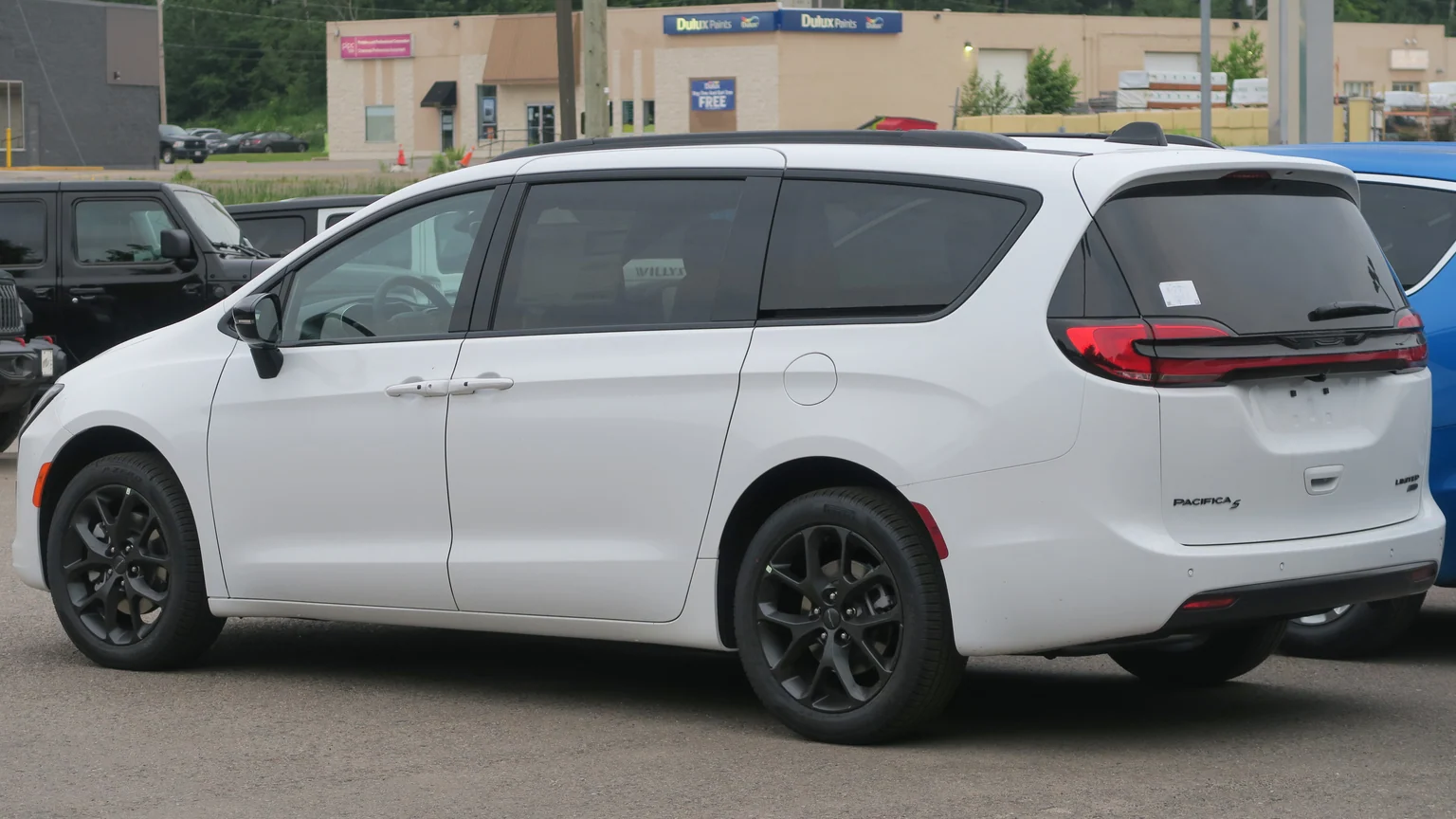 2027 Chrysler Pacifica Limited AWD in Bright White, rear left, 2026-07-01.jpg