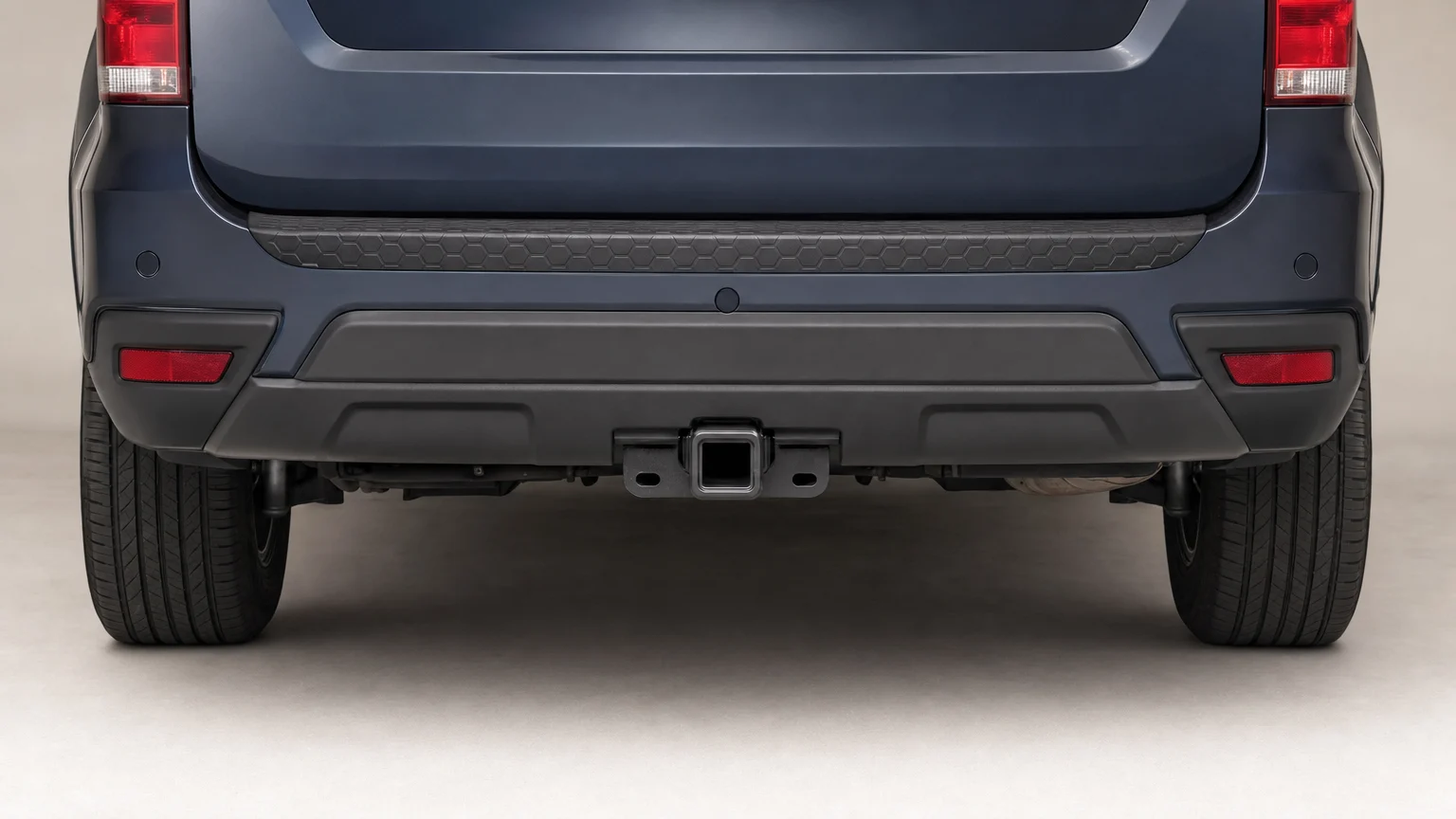 Close-up of a generic SUV’s rear hitch receiver without a ball mount.