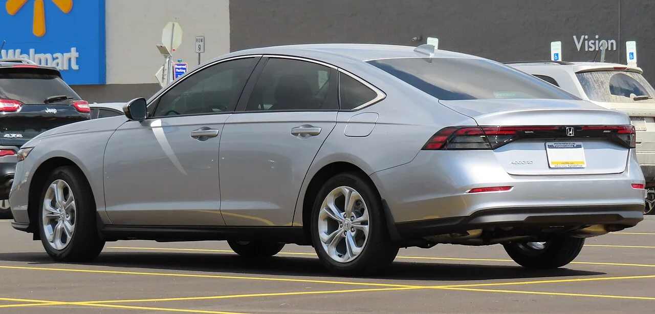 Silver 2023 Honda Accord LX viewed from the rear and side
