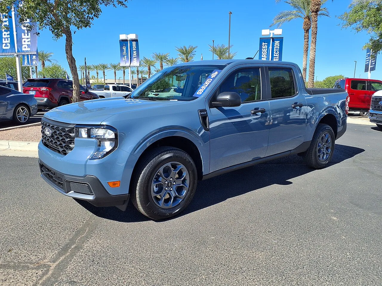 Blue 2025 Ford Maverick XLT at an Arizona dealership